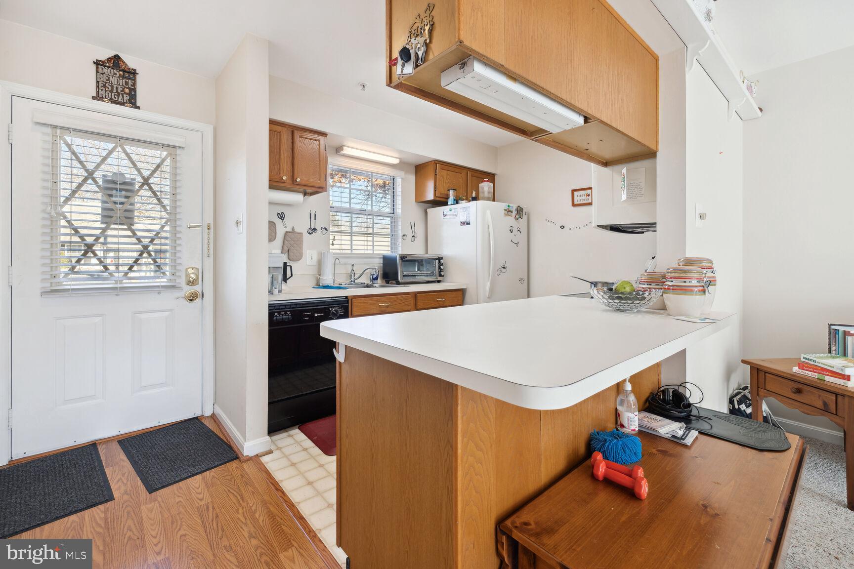 9260 Cherry Lane, Unit 34 Laurel, MD 20708 - Photo 8 of 19 Kitchen Area Showing Front door Exit / Entrance.