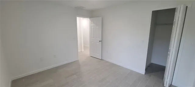 a bathroom with a granite countertop bathtub shower and toilet