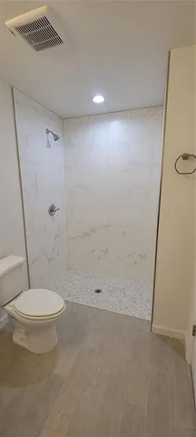 a view of an empty room with closet area