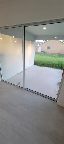 a bathroom with a granite countertop toilet and a sink