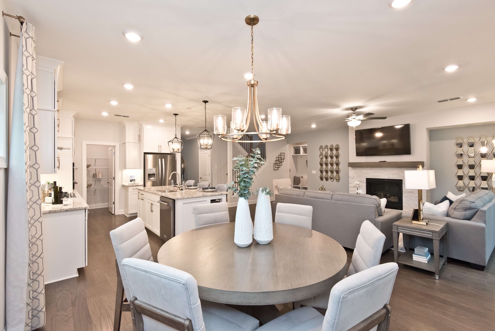 694 Castle Road Mount Juliet, TN 37122 - Photo 5 of 19 a view of a dining room with furniture wooden floor and a chandelier