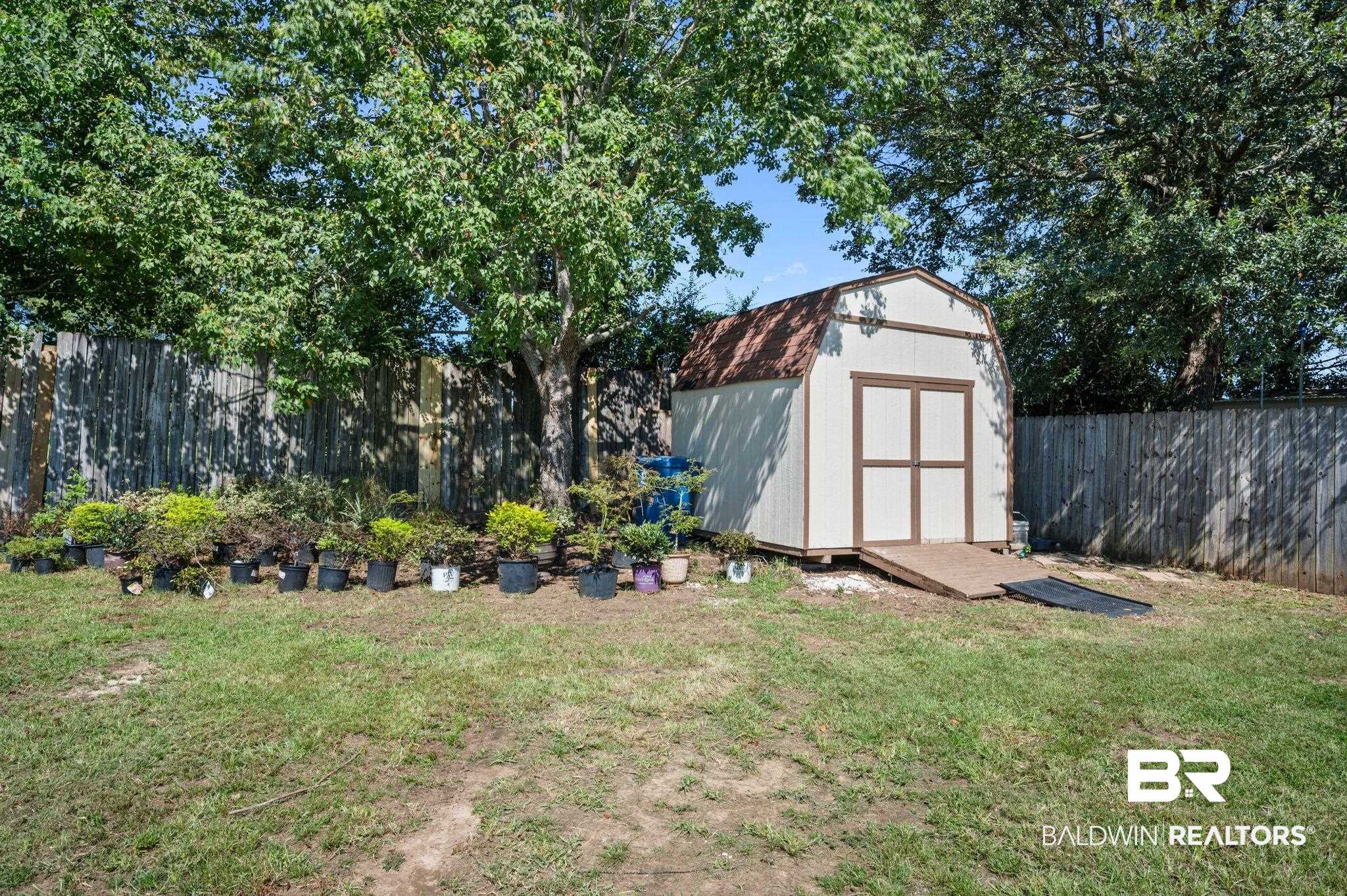 3879 Symphony Way West Semmes, AL 36575 - Photo 32 of 34 View of yard featuring a storage unit