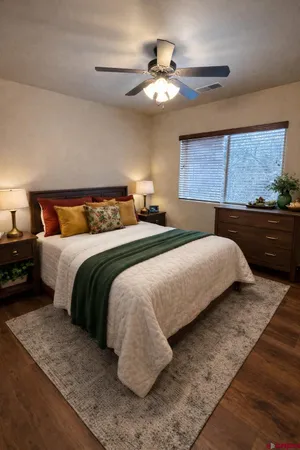 a bedroom with a bed and window