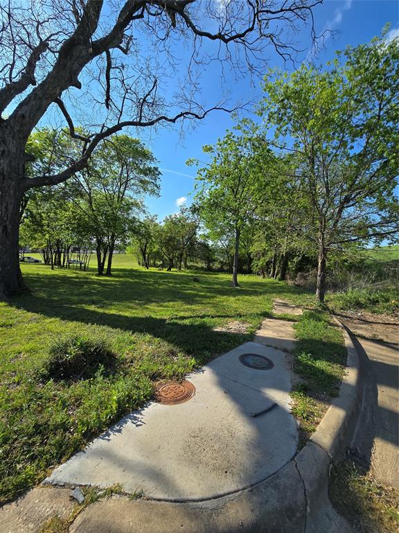823 Millard Street Dallas, TX 75203 - Photo 2 of 25 a view of a playground with a yard