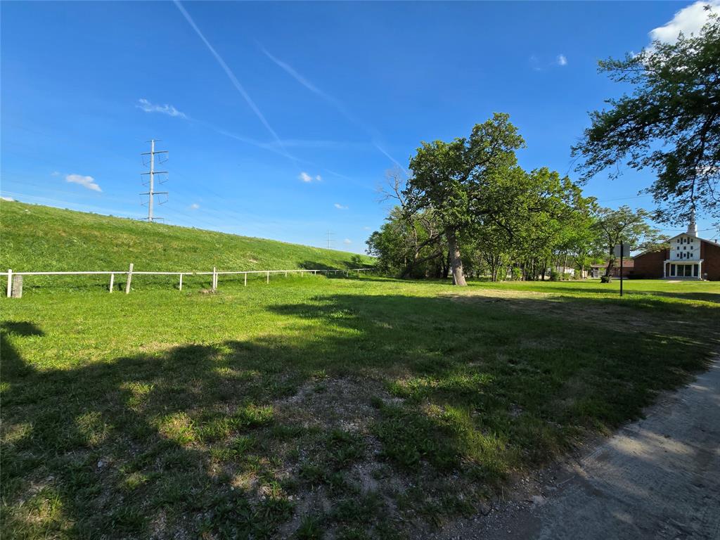 823 Millard Street Dallas, TX 75203 - Photo 22 of 25 a view of a field with grass and a trees