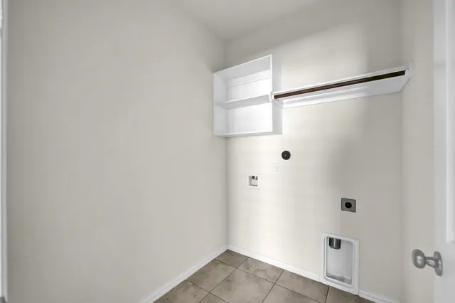 a view of a backyard with a small cabin and wooden fence