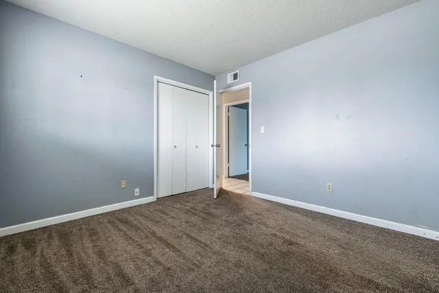 a view of a room with wooden walls