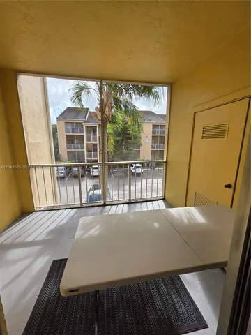 a view of an empty room with a large window