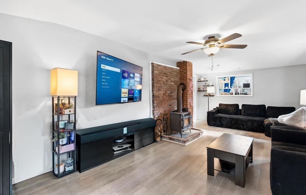 74 Princeton Street Gardner, MA 01440 - Photo 4 of 26 a living room with furniture and a flat screen tv