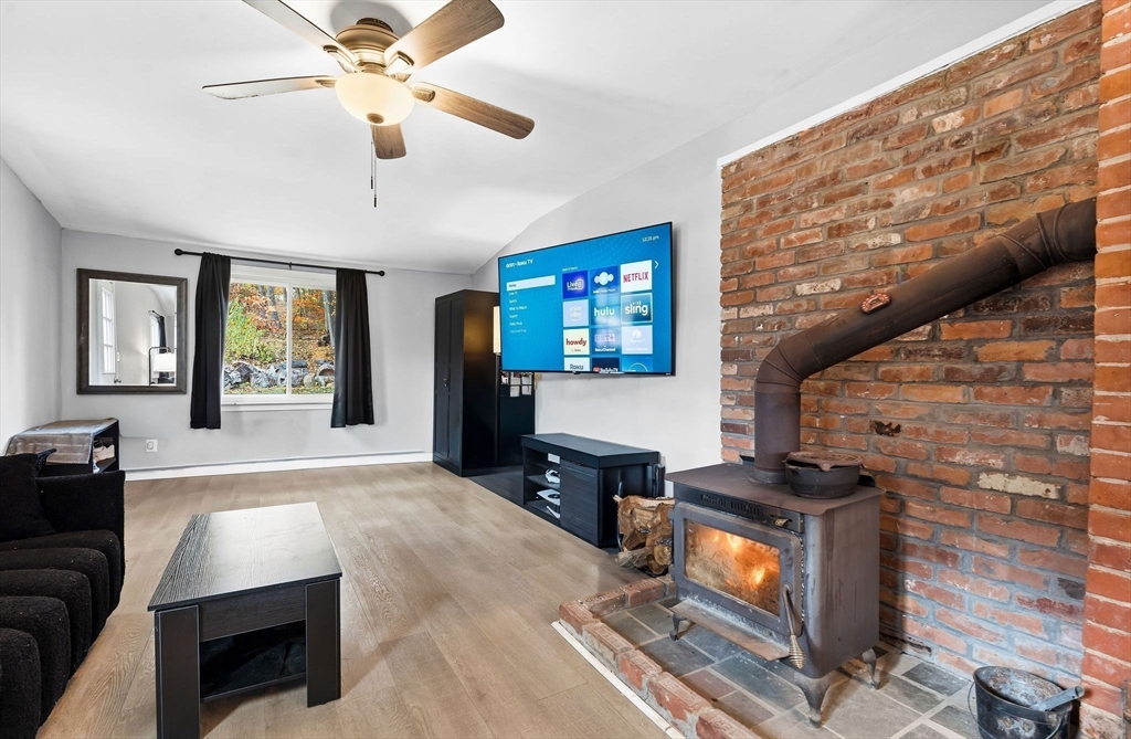 74 Princeton Street Gardner, MA 01440 - Photo 5 of 26 a living room with furniture and a flat screen tv