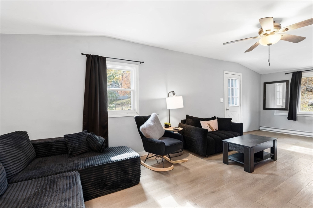 74 Princeton Street Gardner, MA 01440 - Photo 6 of 26 a living room with furniture and a large mirror