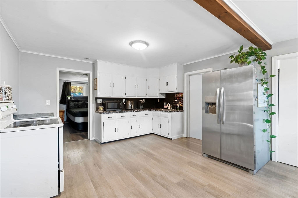 74 Princeton Street Gardner, MA 01440 - Photo 8 of 26 a kitchen with stainless steel appliances a refrigerator and a stove
