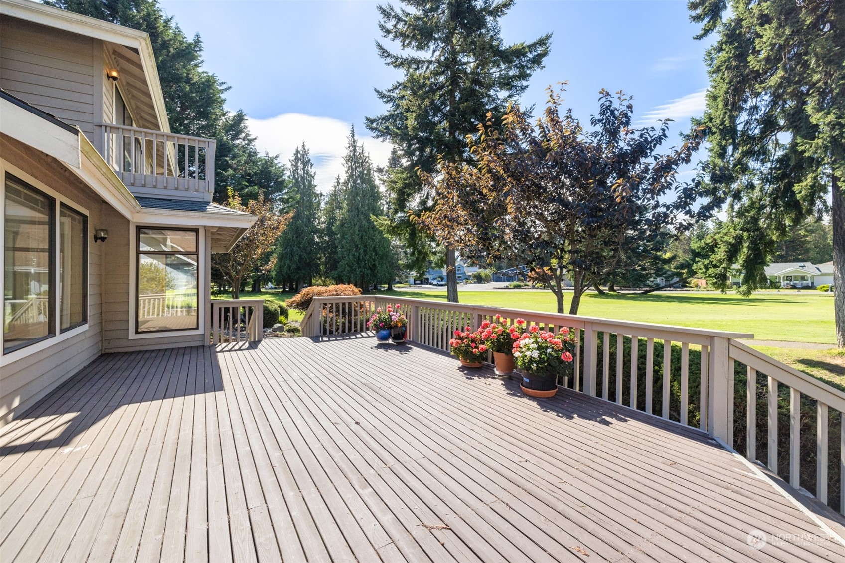 117 Williams Place Sequim, WA 98382 - Photo 13 of 40 a view of a roof deck with couches and wooden floor