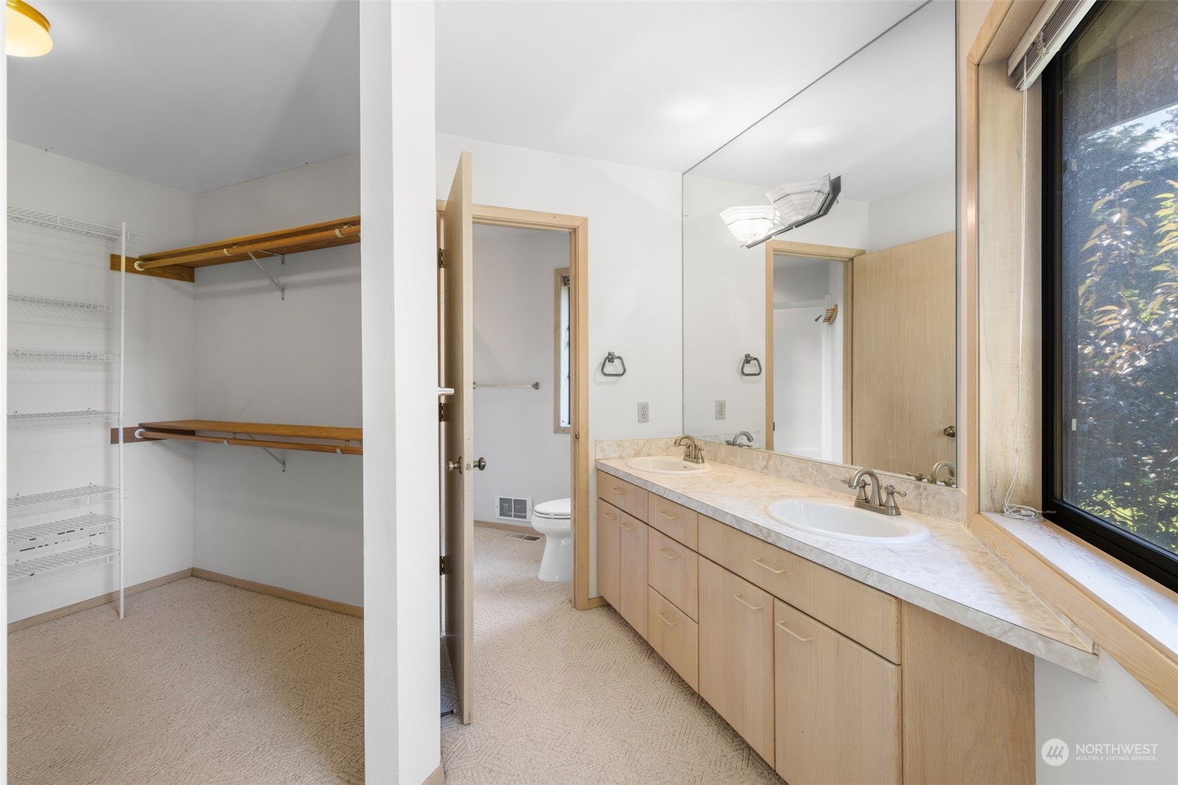 117 Williams Place Sequim, WA 98382 - Photo 26 of 40 a bathroom with a double vanity sink toilet mirror and windows