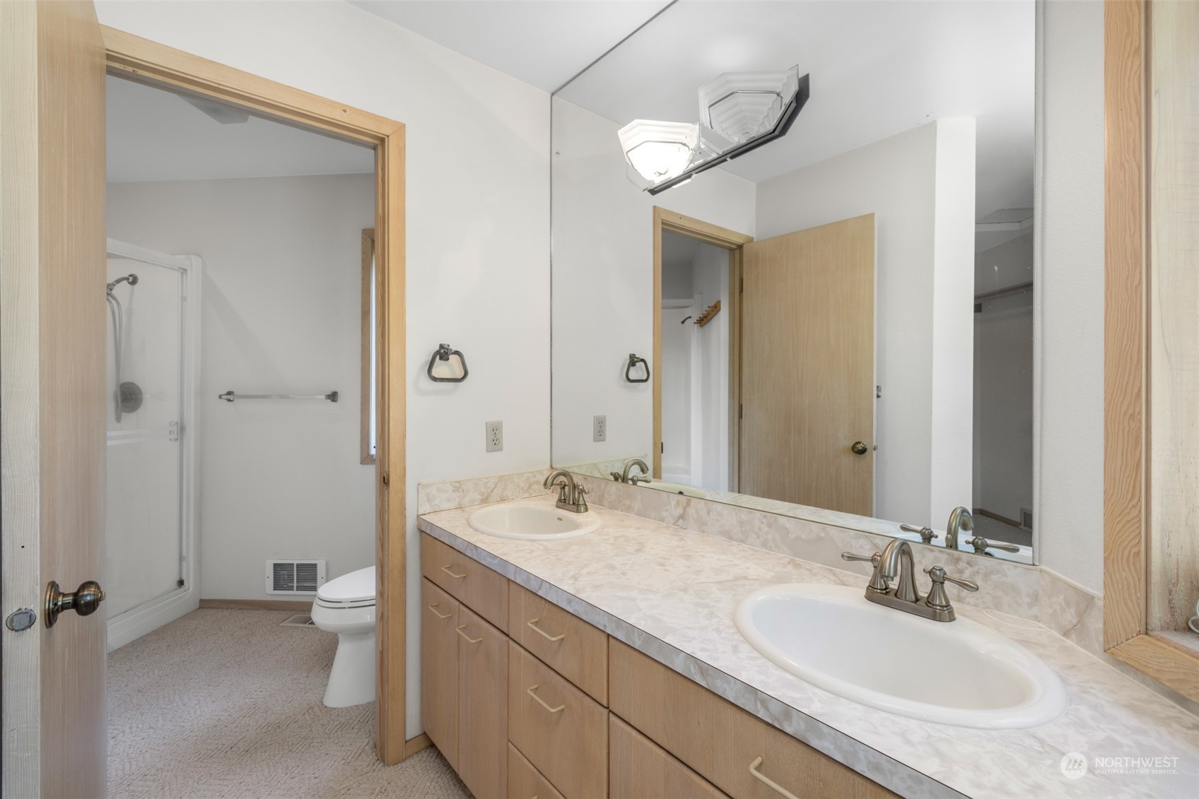 117 Williams Place Sequim, WA 98382 - Photo 27 of 40 a bathroom with a sink and a mirror