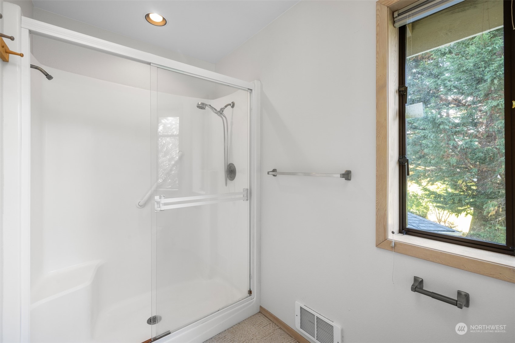 117 Williams Place Sequim, WA 98382 - Photo 28 of 40 a bathroom with a glass shower door