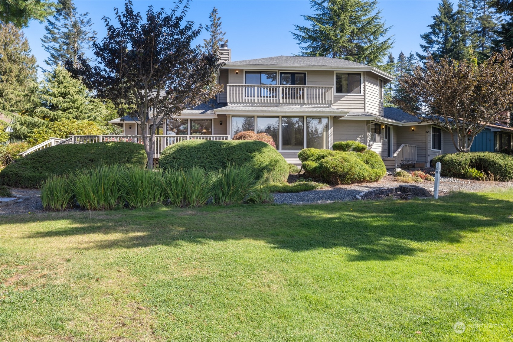 117 Williams Place Sequim, WA 98382 - Photo 35 of 40 a front view of a house with a garden and plants