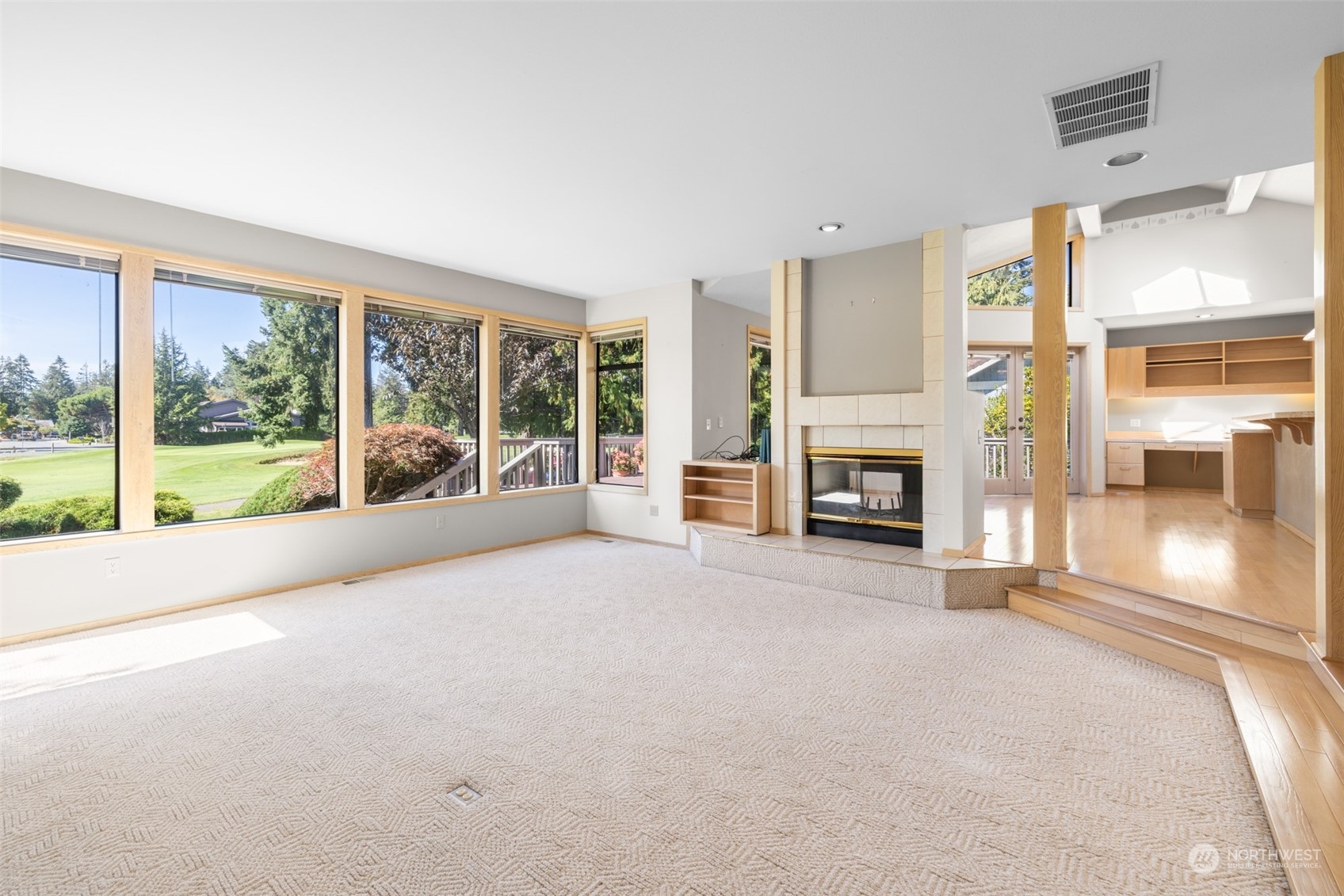 117 Williams Place Sequim, WA 98382 - Photo 5 of 40 a view of a livingroom with a fireplace a swimming pool and outdoor view
