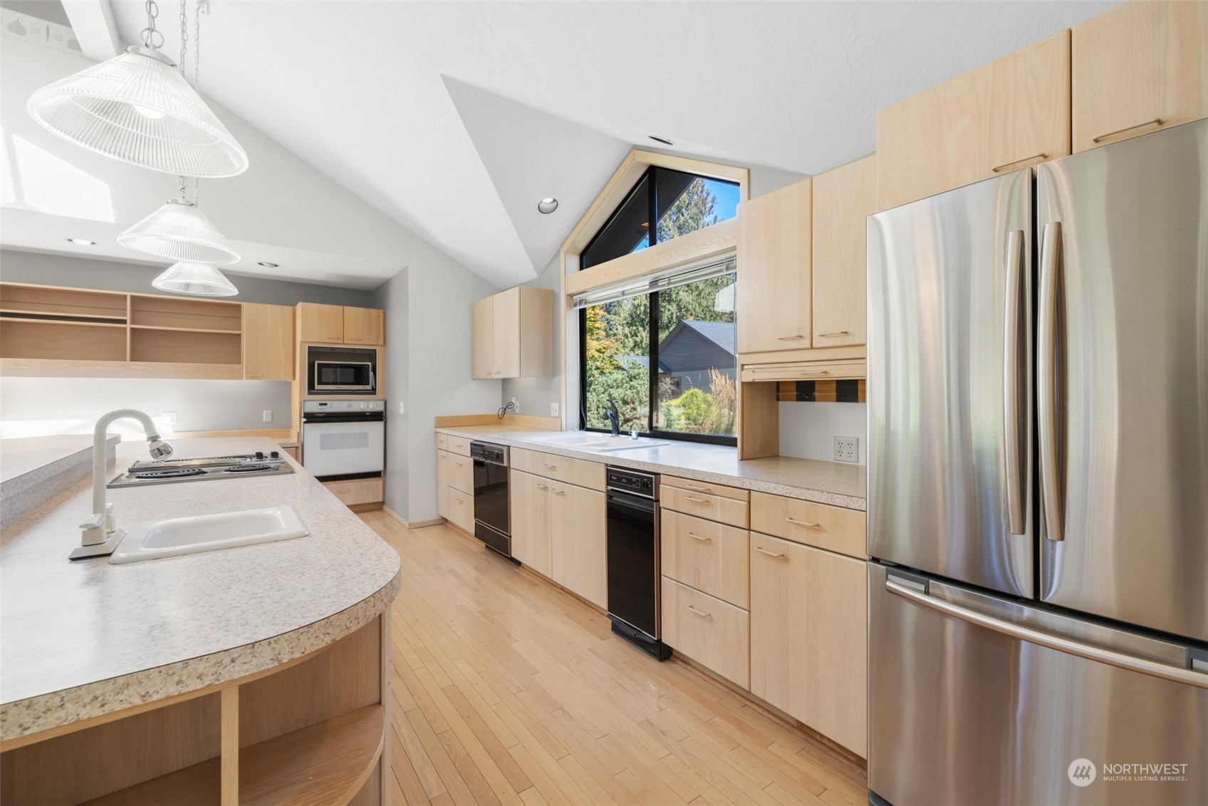 117 Williams Place Sequim, WA 98382 - Photo 8 of 40 a kitchen with stainless steel appliances granite countertop a refrigerator sink and stove