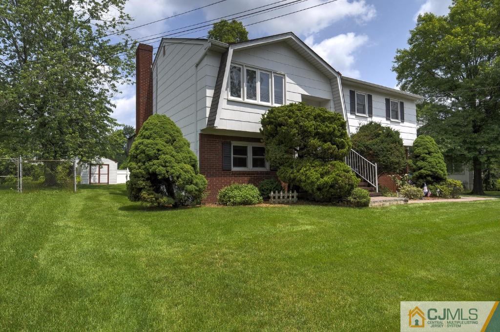 830 Inman Avenue Edison, NJ 08820 - Photo 1 of 21 a front view of house with yard and green space