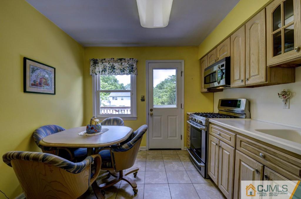 830 Inman Avenue Edison, NJ 08820 - Photo 2 of 21 a kitchen with a table and chairs in it