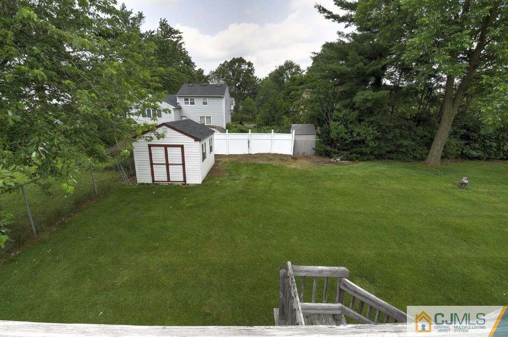830 Inman Avenue Edison, NJ 08820 - Photo 14 of 21 a front view of a house with a garden