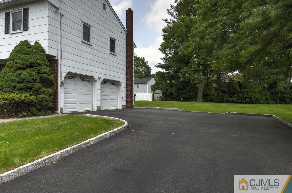 830 Inman Avenue Edison, NJ 08820 - Photo 15 of 21 a view of a house with a backyard