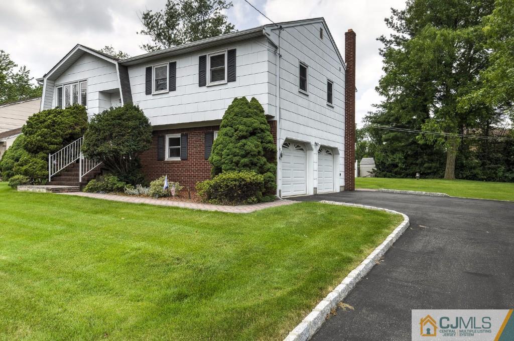 830 Inman Avenue Edison, NJ 08820 - Photo 16 of 21 a front view of house with yard and green space