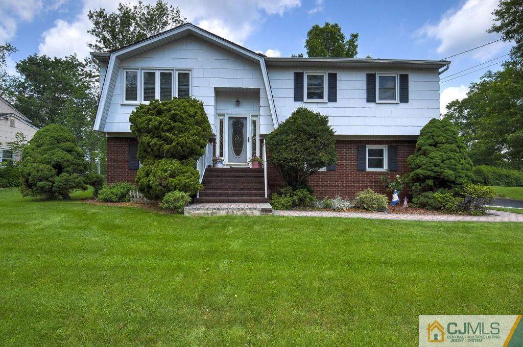 830 Inman Avenue Edison, NJ 08820 - Photo 19 of 21 a front view of a house with a yard and garage