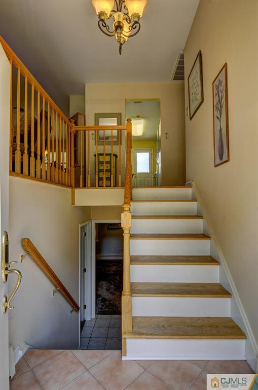 830 Inman Avenue Edison, NJ 08820 - Photo 3 of 21 a view of entryway and hall with wooden floor