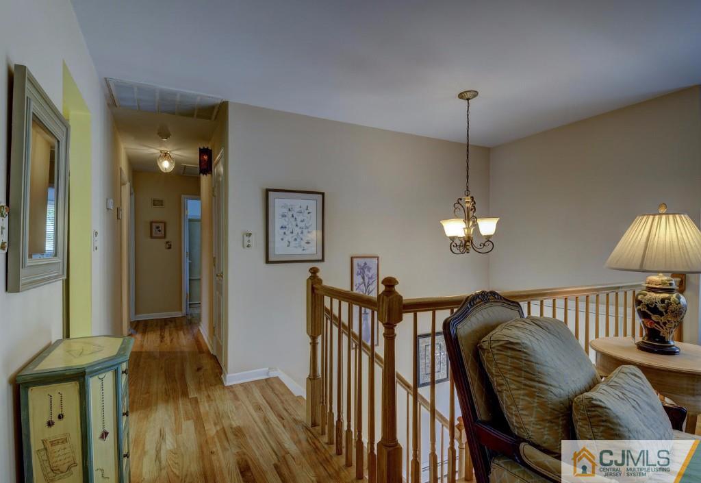 830 Inman Avenue Edison, NJ 08820 - Photo 9 of 21 a view of a livingroom with furniture wooden floor and chandelier