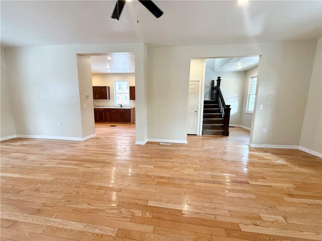 841 2nd Avenue Beaver Falls, PA 15010 - Photo 6 of 23 a view of a room with wooden floor and stairs