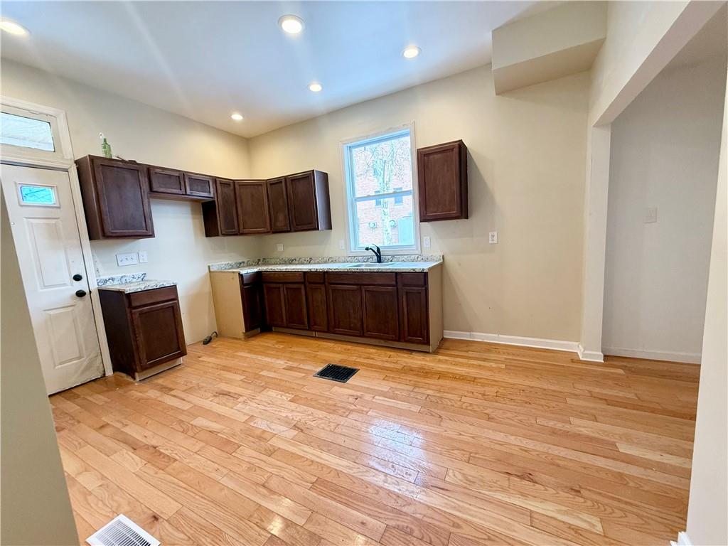 841 2nd Avenue Beaver Falls, PA 15010 - Photo 8 of 23 a kitchen with stainless steel appliances a refrigerator and a microwave