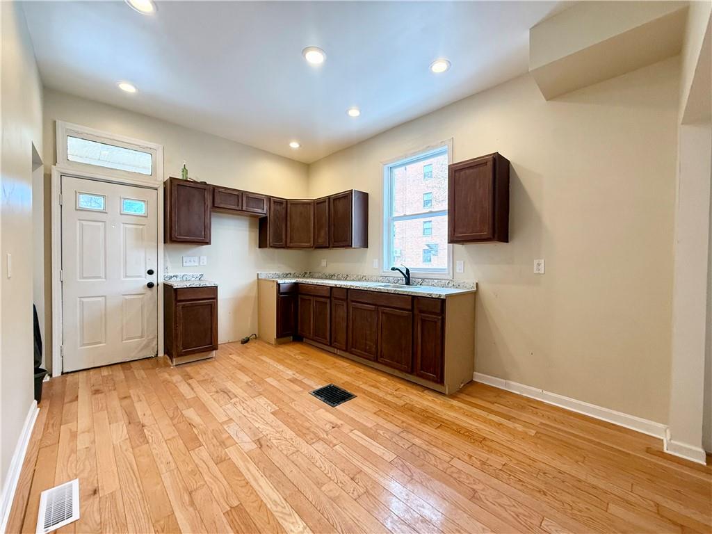 841 2nd Avenue Beaver Falls, PA 15010 - Photo 9 of 23 a kitchen with stainless steel appliances a sink and a microwave