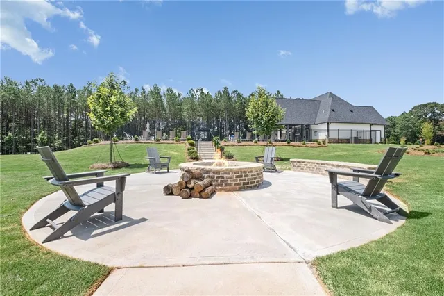 a view of a park with lounge chairs in the patio
