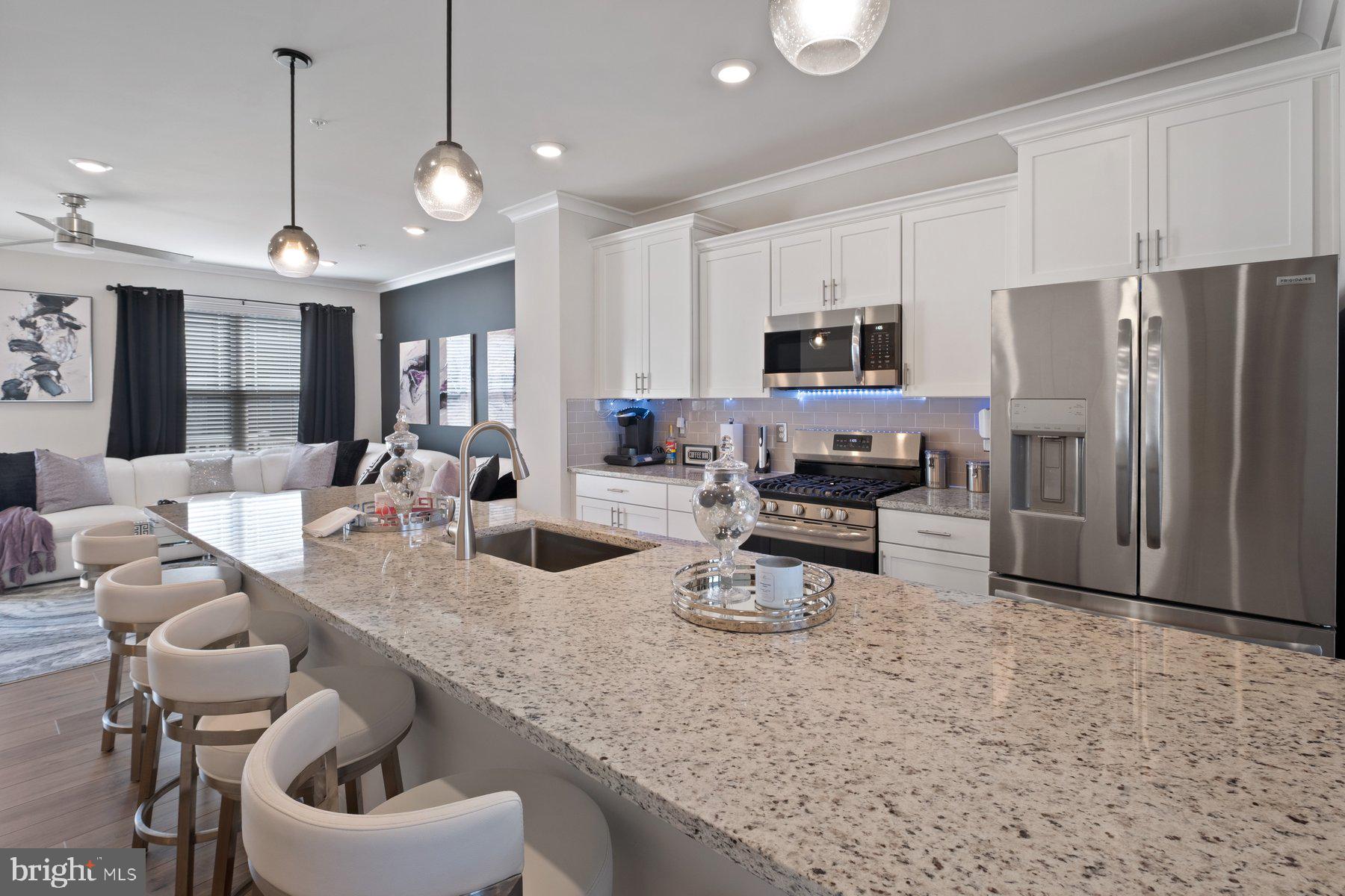 6960 Farragut Drive Bryans Road, MD 20616 - Photo 13 of 25 a kitchen with sink refrigerator and microwave