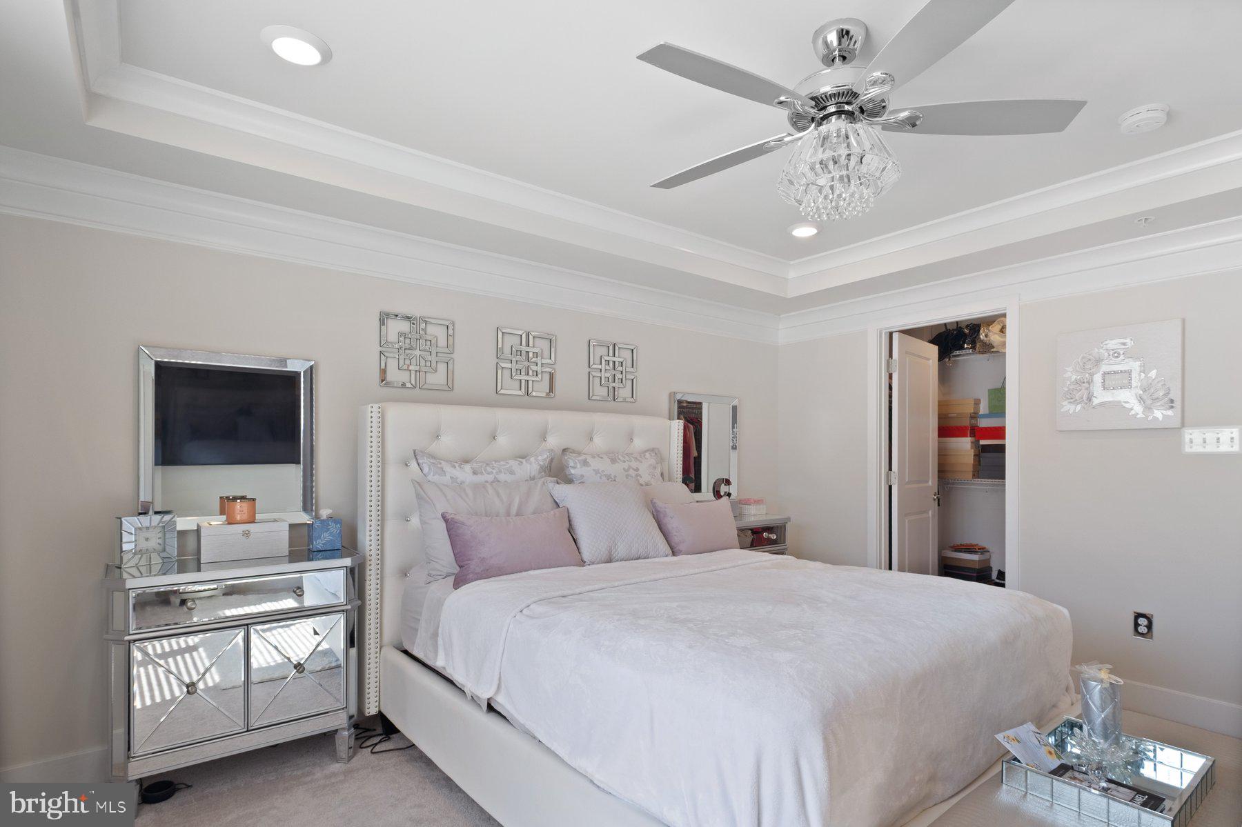 6960 Farragut Drive Bryans Road, MD 20616 - Photo 15 of 25 a bedroom with a large bed and a flat screen tv