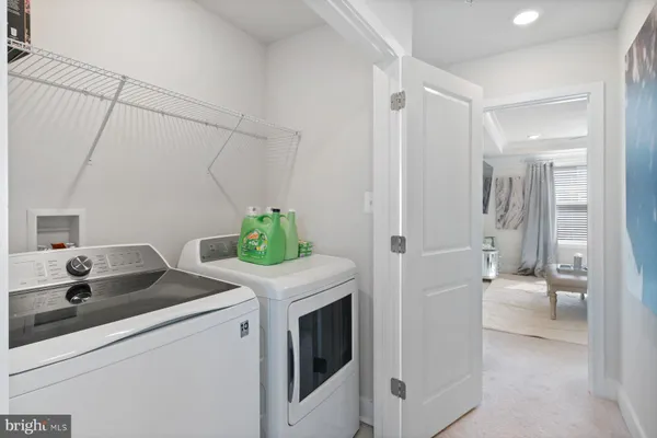 a kitchen with a sink and refrigerator
