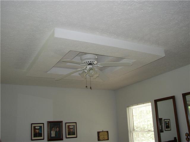 66 Young Mountain Road Pelham, TN 37366 - Photo 13 of 20 a view of a livingroom with a ceiling fan and window
