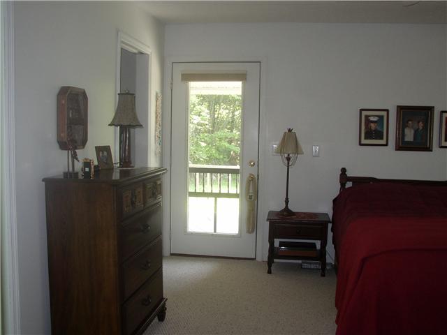 66 Young Mountain Road Pelham, TN 37366 - Photo 14 of 20 a living room with furniture and a window