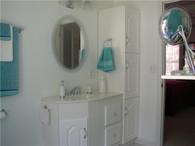 66 Young Mountain Road Pelham, TN 37366 - Photo 17 of 20 a bathroom with a sink and mirror