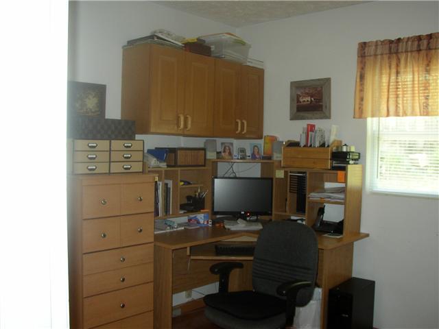 66 Young Mountain Road Pelham, TN 37366 - Photo 18 of 20 a view of a workspace with furniture and a window