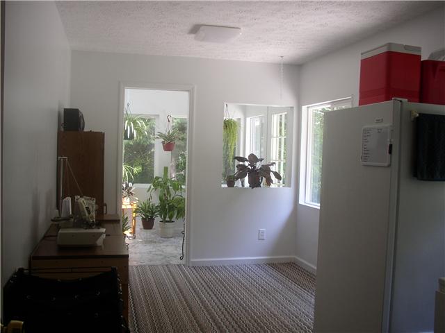 66 Young Mountain Road Pelham, TN 37366 - Photo 19 of 20 a kitchen with a refrigerator and a wooden floor
