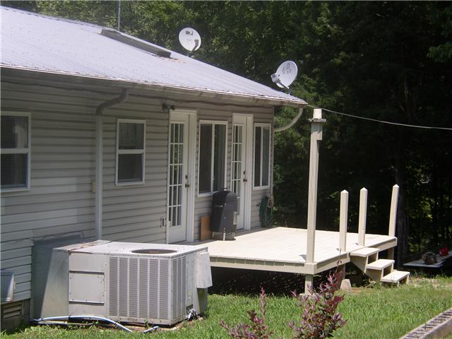 66 Young Mountain Road Pelham, TN 37366 - Photo 6 of 20 a view of a house with backyard and porch