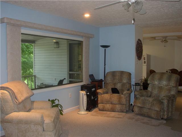 66 Young Mountain Road Pelham, TN 37366 - Photo 8 of 20 a living room with furniture and a large window