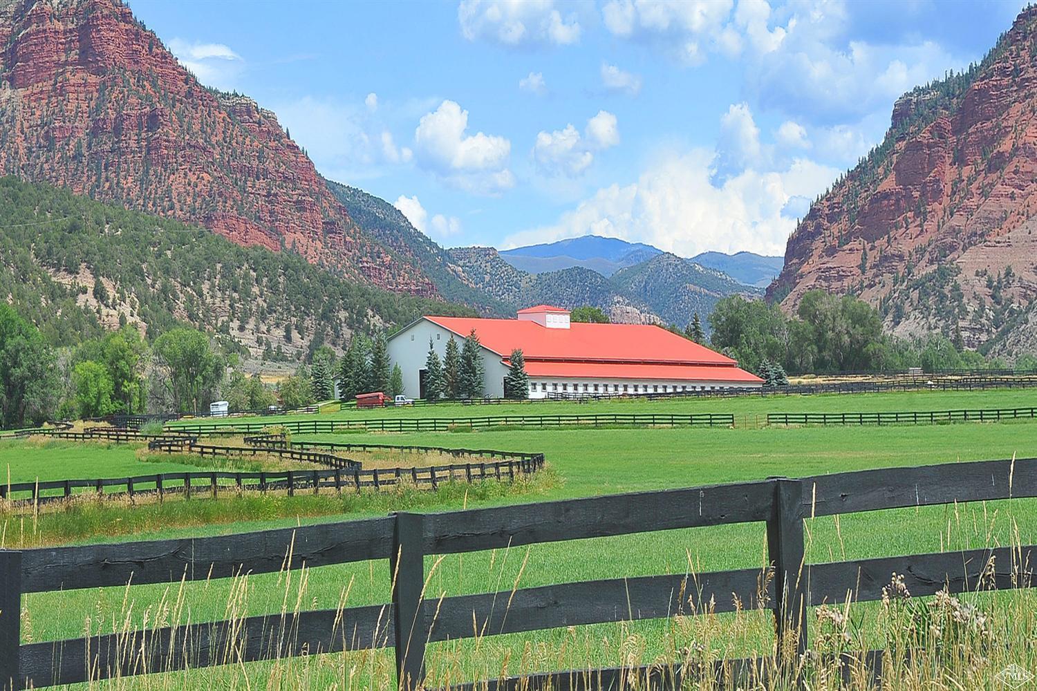 a yellow and red umbrella sitting in front of a building