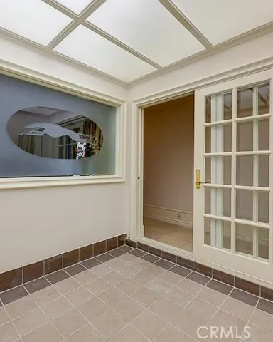 a view of a door and a window