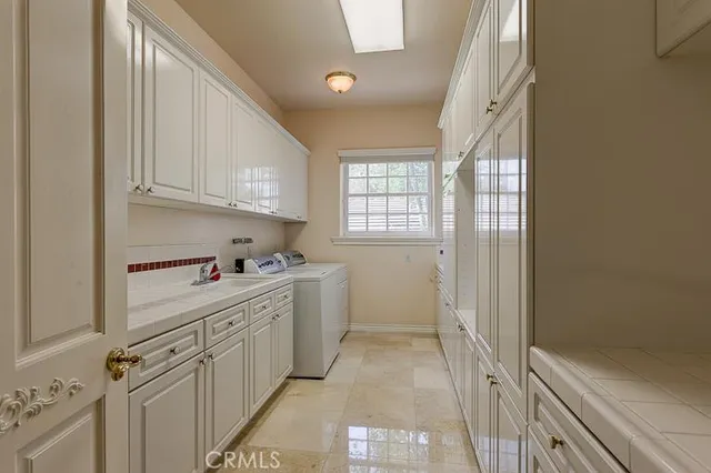 a kitchen with cabinets and window