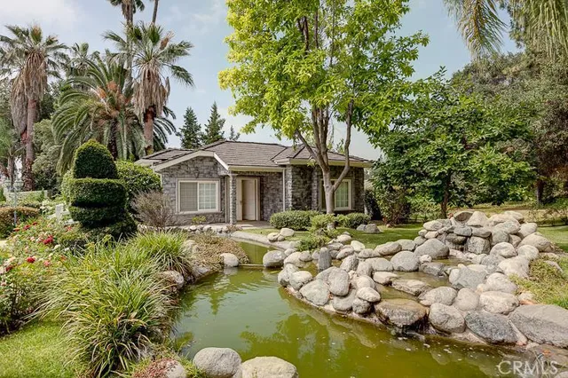 a front view of a house with garden