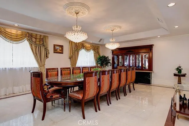 a view of a dining room with furniture and window